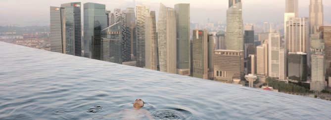 A man floats in the 57th-floor swimming pool of the Marina Bay Sands Hotel, with the skyline of the Singapore financial district behind him.
2013
Paolo Woods & Gabriele GalimbertiÑINSTITUTE