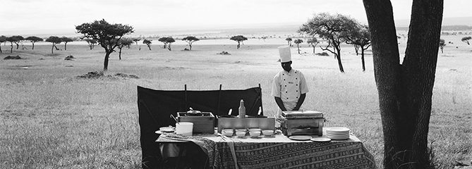 A chef from a nearby luxury lodge waits for his guests to arrive from a hot air balloon excursion before serving them champagne in the middle of the Maasai Mara National Reserve, Kenya.
2012
Guillaume Bonn