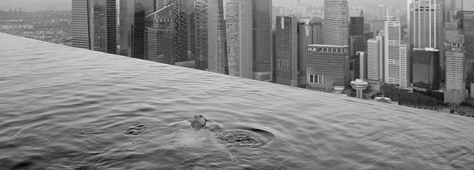 A man floats in the 57th-floor swimming pool of the Marina Bay Sands Hotel, with the skyline of the Singapore financial district behind him.
2013
Paolo Woods & Gabriele GalimbertiÑINSTITUTE
